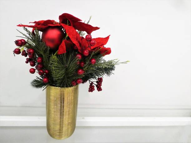 istock Decorative Christmas Traditional Flowers in a Vase 1280892395