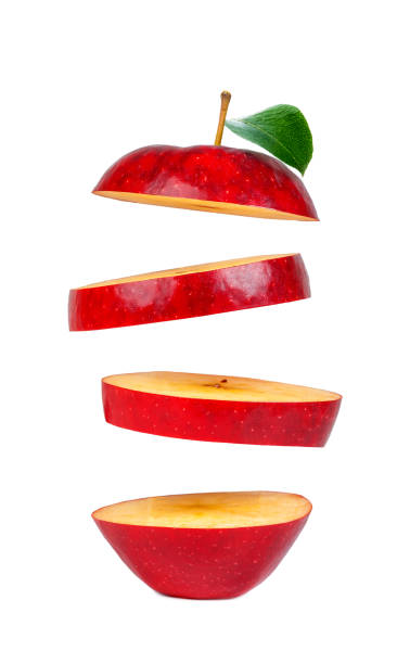 istock red apple with a green leaf, oval slices, even cuts across across isolated on a white background 1280892581