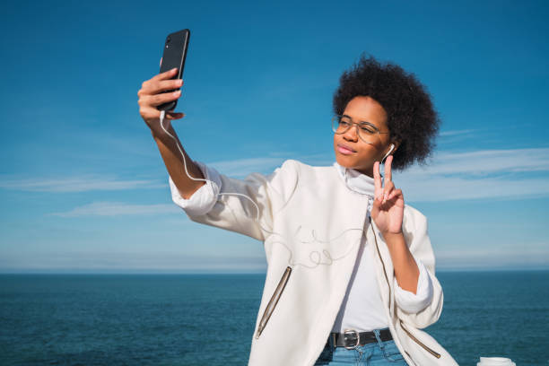istock Young woman taking selfies with phone. 1280894815