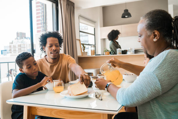 istock Family having breakfast together at home. 1280894911