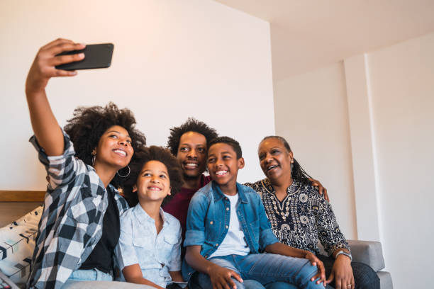 istock Multigenerational family taking selfie with phone at home. 1280894921