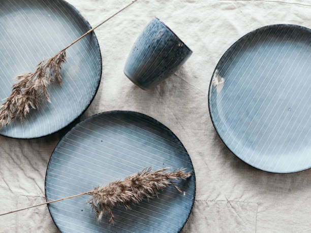 istock Set of a blue kitchen ceramic tableware oner linen cloth. Eco and minimal style home still life. 1280896967