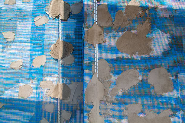 istock surface of wall with applied construction grid and guides for plaster application 1280898159
