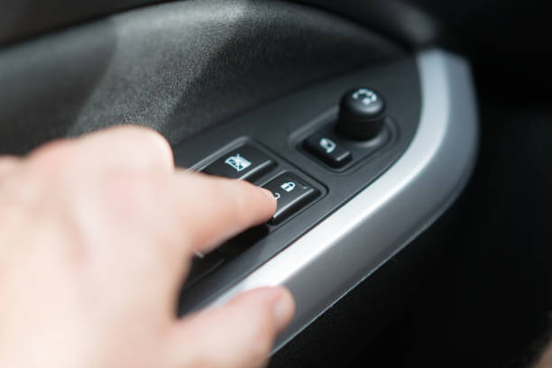istock A man's hand pressing the button to lock the car. 1280898396