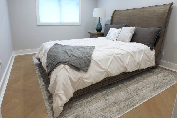 istock Bedroom in luxury home with white comforter 1280900435