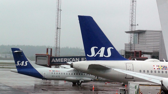 Scandinavian Airlines Passengers Airplane Packed At Loading, Unloading Gate Of Stockholm Arlanda International Airport In Sweden Northern Europe