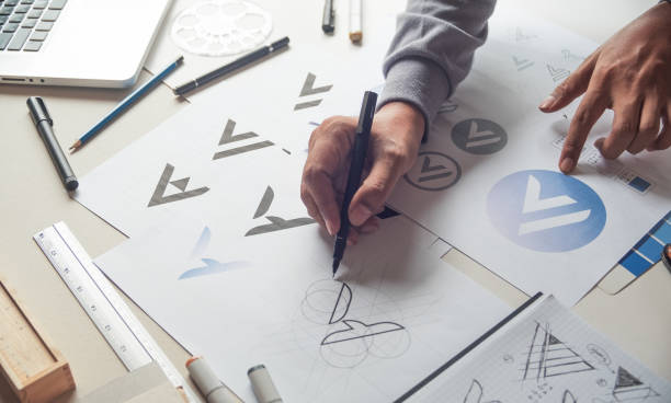istock Graphic designer creative design sketch drawing logo Trademark brand Workspace 1280904371