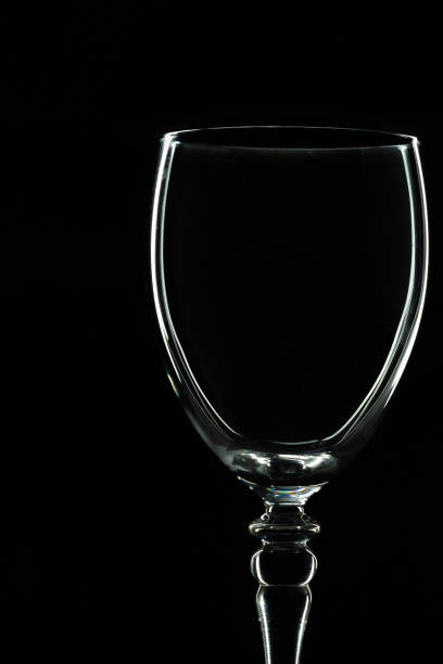 istock Low key studio image of a wine glass with a black background. 1280907277