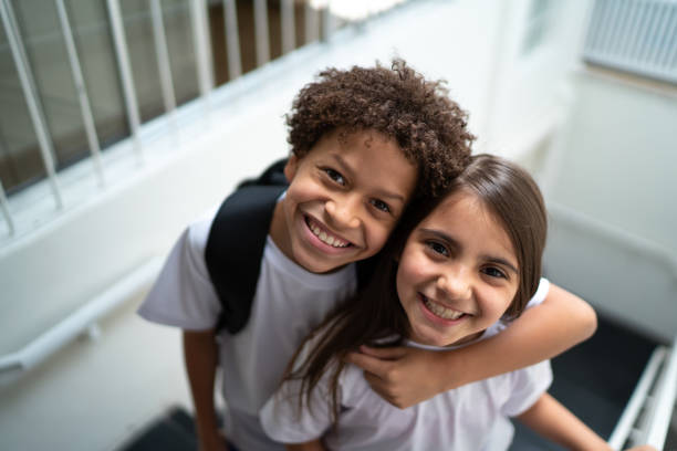 Portrait of two elementary students at school Portrait of two elementary students at school pre adolescent child stock pictures, royalty-free photos & images