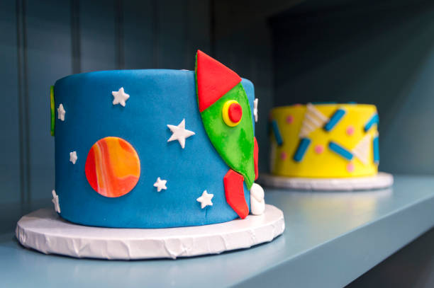 istock Small Colorful Model Cakes on a Shelf 1280912218