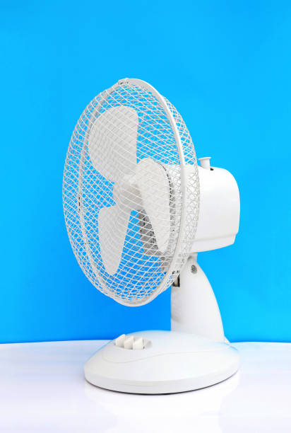 istock white desk oscillating fan on blue background 1280915144