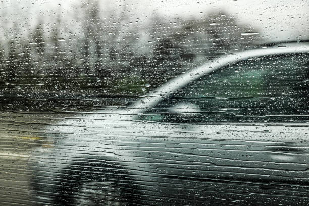 istock Car Overtaking on a Highway at High Speed, with Rain Falling 1280916667