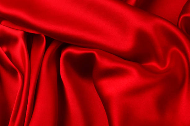 istock Red silk or satin luxury fabric texture can use as abstract background. Top view 1280918828