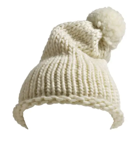 White wool hat with pom pom, isolated on white background.