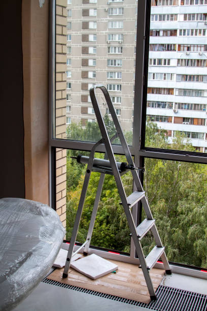 istock Stepladder near window with glass removed in apartment 1280919097
