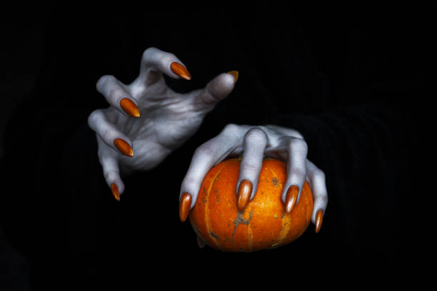 High Angle View Of Woman Wearing Costume While Holding Apple During Halloween