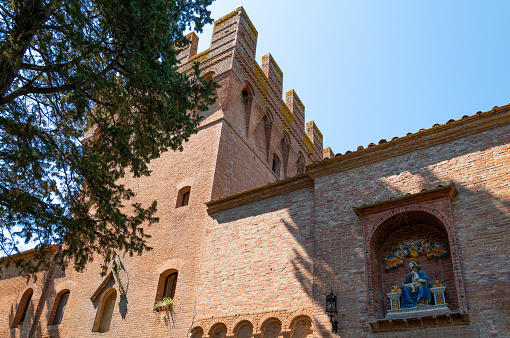 Italy, Asciano,  Abbey of Santa Maria of Monte Oliveto Maggiore, the walls and the crenellated tower