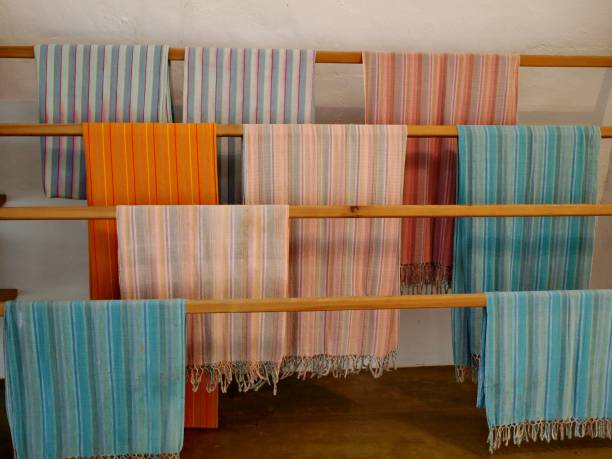 istock Colorful towels hang over wooden pole 1280924955