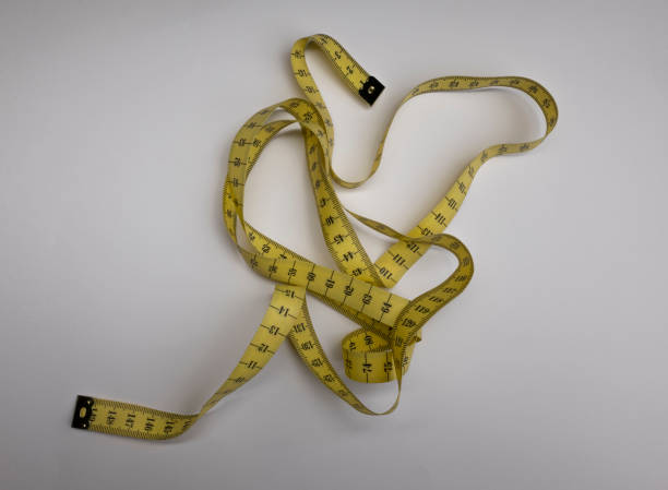istock Sewing kit measuring tape on white background 1280926891