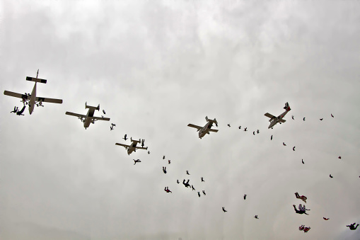 April 26, 2012. Eloy, Arizona, United States. A large group of skydivers jump from various aircraft.