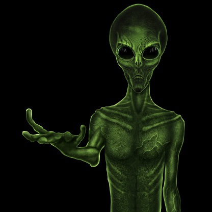 Green alien standing next to his UFO spaceship.