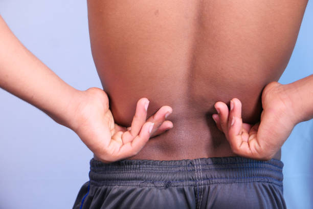 istock young man suffering back pain close up 1280928113