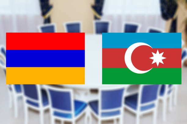 Flags of Azerbaijan and Armenia on the background of the round table. The truce of the warring parties Flags of Azerbaijan and Armenia on the background of the round table. The truce of the warring parties or diplomatic negotiations on the cessation of hostilities truce flag stock pictures, royalty-free photos & images