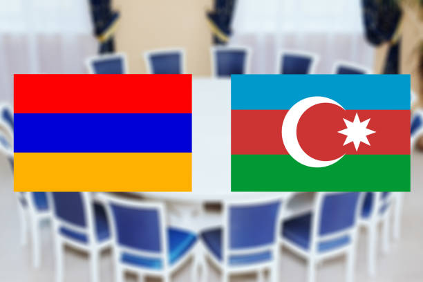 flags of azerbaijan and armenia on the background of the round table. the truce of the warring parties - warring imagens e fotografias de stock