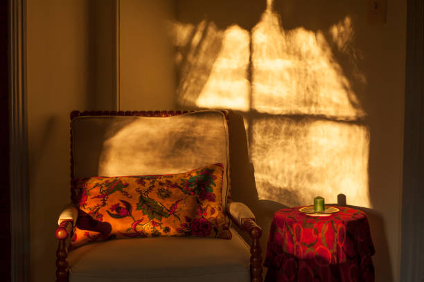 istock Chair with cushion and a window shadow 1280929172