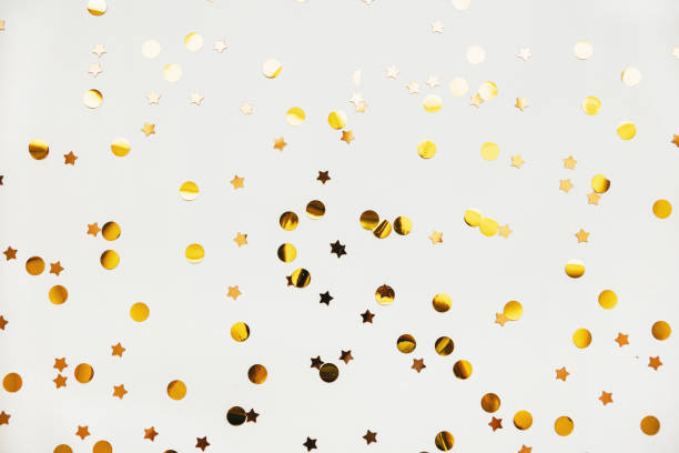 istock Scattered golden confetti background 1280930418