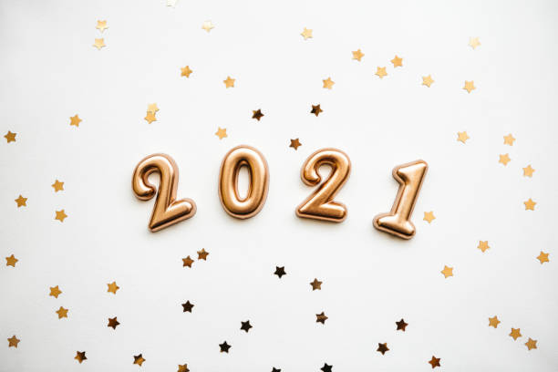 istock Gold numbers 2021 with gold confetti 1280930436