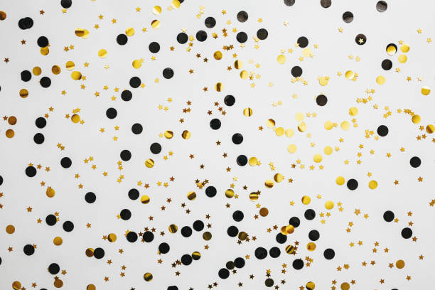 istock Scattered golden confetti background 1280930483