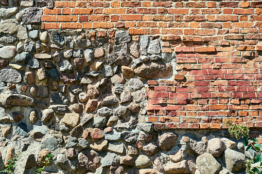 Fragment of a medieval stone and brick defensive wall in the city of Poznan