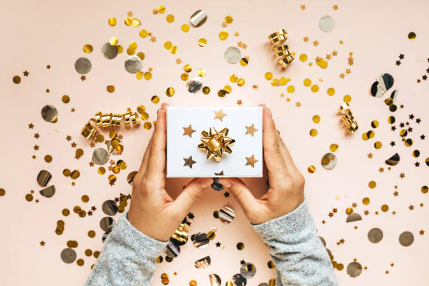 istock A girl holds a box with a gift 1280931246