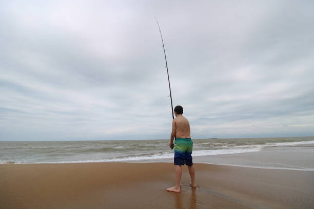 istock child fishing on the beach 1280931267