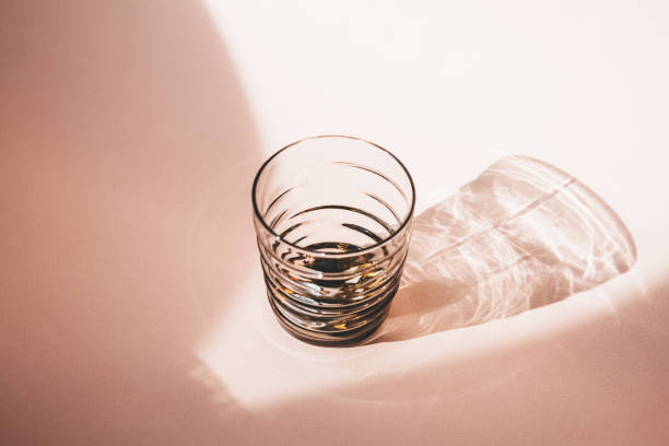 istock Glass on a pink background 1280932826