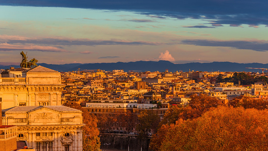 Rome historic center skyline at sunset with the Old Palace of Justice and autumn red leaves
