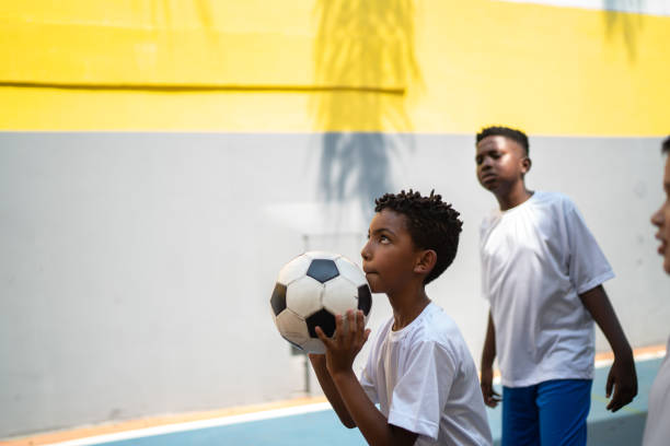 istock Focus boy playing basketball at school 1280937817