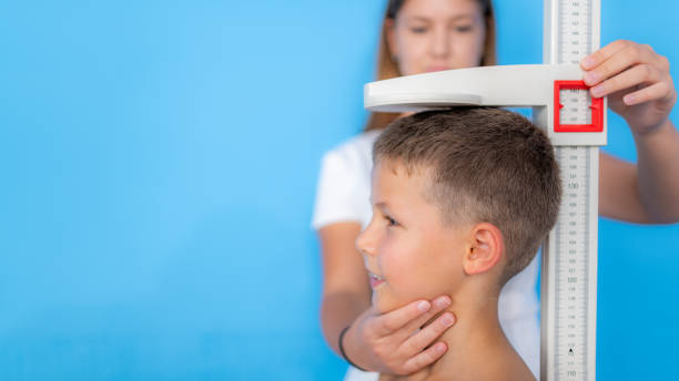 istock Measuring height of children, auxologic anthropometry 1280939348