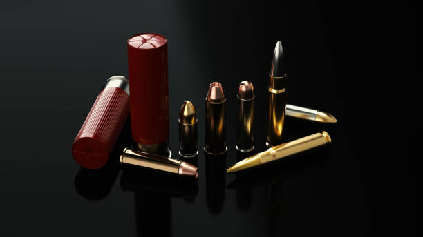Bullets Pistol and rifle bullets on a dark background. ammunition stock pictures, royalty-free photos & images