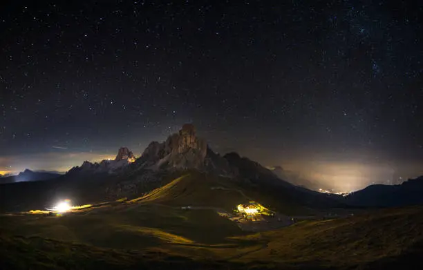 NIght picture of Passo Giau and Mount Nuvolau and Averau under a sky full of stars in Cortina D'ampezzo, famous ski resort in the Dolomites