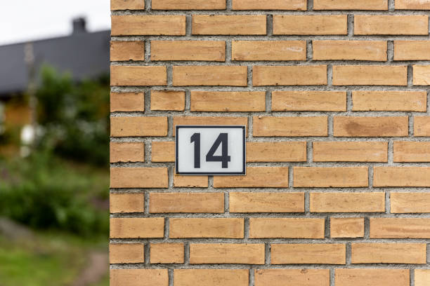 istock Sign with number 14 on a brick wall... 1280942951