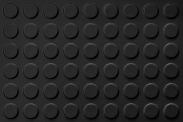 istock black abstract Background with circular holes geometric texture 1280945299