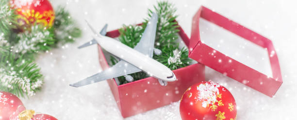 istock Travel for Christmas. Airplane with Christmas decor. Selective focus. 1280946290