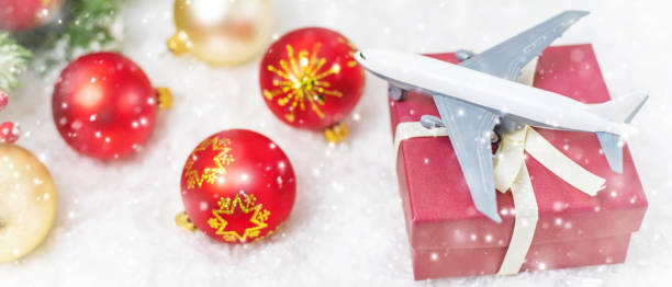 istock Travel for Christmas. Airplane with Christmas decor. Selective focus. 1280946295