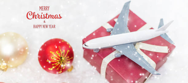 istock Travel for Christmas. Airplane with Christmas decor. Selective focus. 1280946300