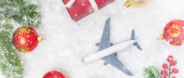 istock Travel for Christmas. Airplane with Christmas decor. Selective focus. 1280946302