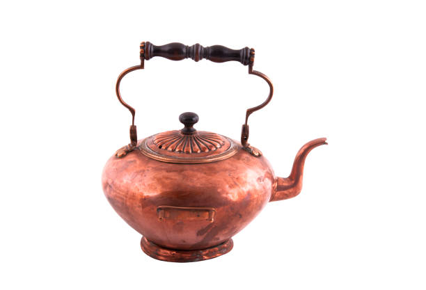 istock Copper kettle with wooden handle isolated 1280946913
