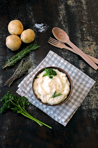 istock Mashed potatoes in a bowl. Homemade mashed potatoes with fragrant herbs. 1280950104