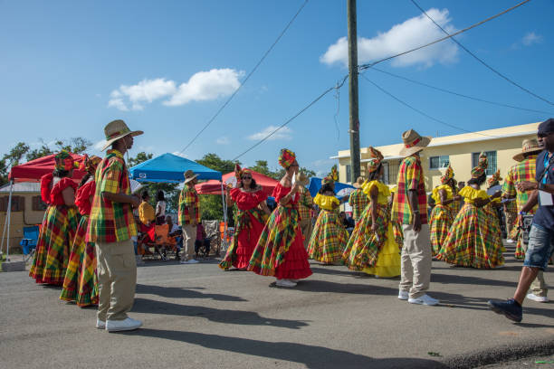 Caribbean Quadrille Dance Group Frederiksted, St. Croix, US Virgin Islands-January 4,2020: Caribbean parade in downtown Frederiksted with matching traditional dance group and spectators on the west end of St. Croix. quadrille to stock pictures, royalty-free photos & images